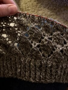 WIP of the Peerie Leaves sweater. A woolly leave lace design in grey yarn